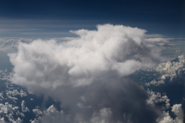 Fototapeta na wymiar Aerial view of the top of a Cumulonimbus cloud from an jet plane