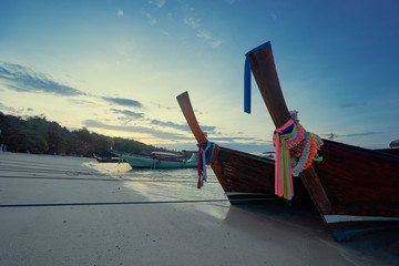 Fototapeta premium Travel by Thailand. Landscape with traditional longtail fishing boat on the sea beach.