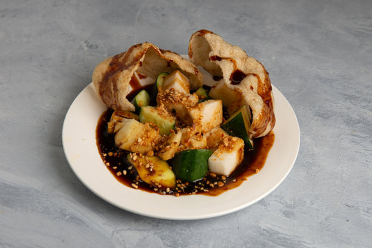 Rojak Buah  traditional Asian fruits mixed with peanut, chilly and sauce