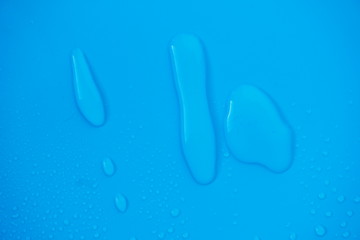 Water Drops On Blue Background.