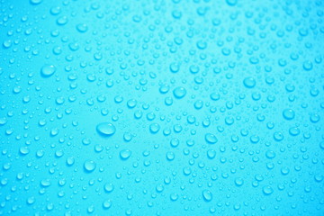 Water Drops On Blue Background.