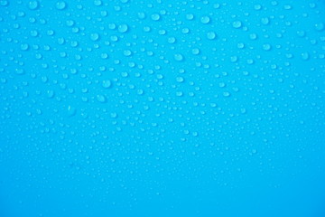 Water Drops On Blue Background.