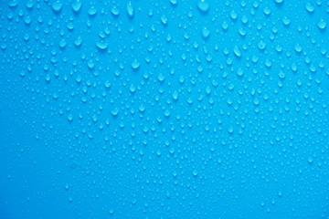 Fototapeta na wymiar Water Drops On Blue Background.