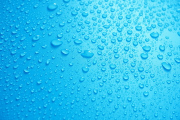 Water Drops On Blue Background.