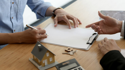 Cropped shot of Real estate customer signing home loan agreement