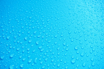 Water Drops On Blue Background.
