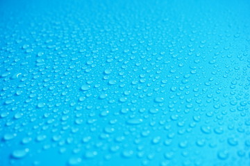 Water Drops On Blue Background.