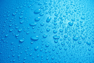 Water Drops On Blue Background.