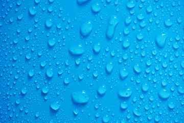 Plakat Water Drops On Blue Background.