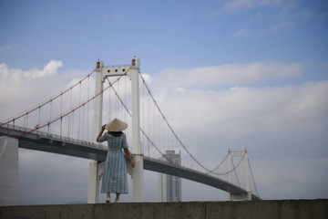 Asian woman is enjoy traveling and sightseeing at famous landmark in Danang, Vietnam.