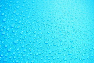 Water Drops On Blue Background.
