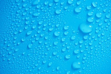 Water Drops On Blue Background.