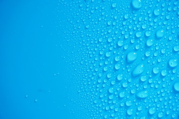 Water Drops On Blue Background.