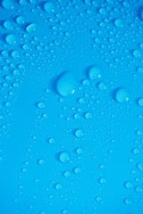 Water Drops On Blue Background.