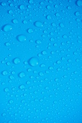 Water Drops On Blue Background.