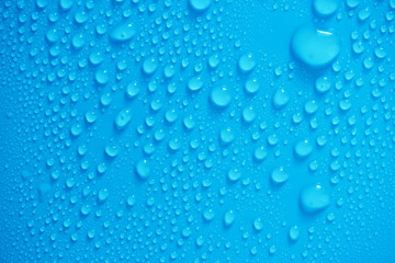 Water Drops On Blue Background.
