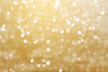 Abstract golden bokeh light with out of focus glister background