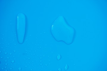 Water Drops On Blue Background.