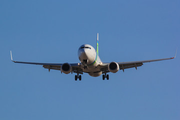 Civil aircraft close up landing on Runway