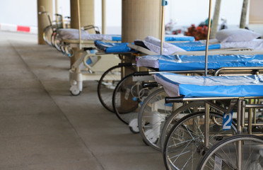Fototapeta na wymiar Closeup of wheel-beds and stretchers in front of O.P.D. preparing for emergency medical service.