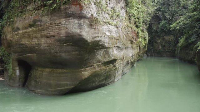 Guejar Canyon, in Mesetas Colombia, crystal clear waters, emerald green waters, low-altitude overflight, with large stones. Aerial drone video.