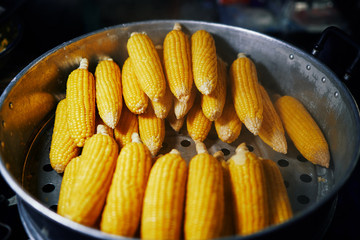 Boiled corn sold at the street food court in Thailand.