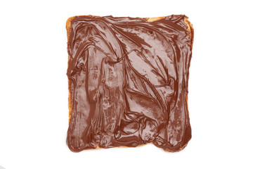 Chocolate spread on a slice of toast. isolated.