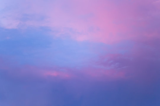 Background image of the evening sky. Beautiful clouds at sunset. Blue color. lilac, pink.