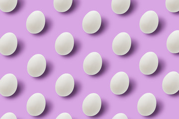 Easter white eggs on pink background.