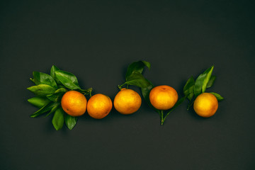 top view tangerines on a black background