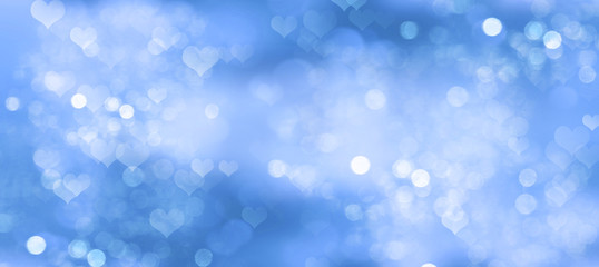 Abstract illustration with blurred hearts on blue background	