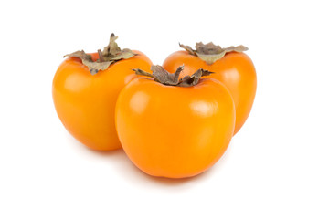 Ripe orange persimmon fruit isolated on white background. Set of kaki.