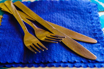 Two knifes and forks on handkerchief