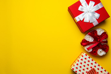 Red gift boxes on a yellow background.Flat lay,copy space