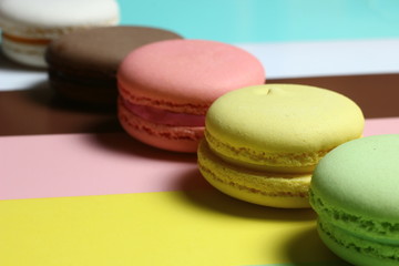 colored almond cakes on a multicolored background
