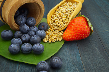 Food still life with blueberries and strawberries