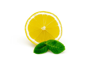 Half sliced lemon and mint leaves