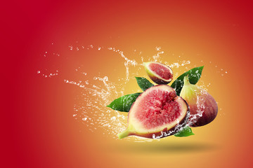 Water splashing on Fresh figs over red background