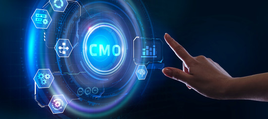 Business, Technology, Internet and network concept. Young businessman working on a virtual screen of the future and sees the inscription: CMO