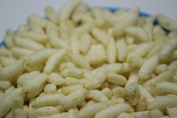 Puffed rice on the silver bowl with white background