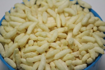 Puffed rice on the silver bowl with white background