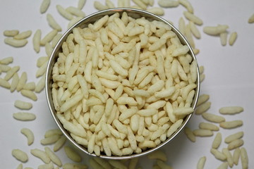 Puffed rice on the silver bowl with white background