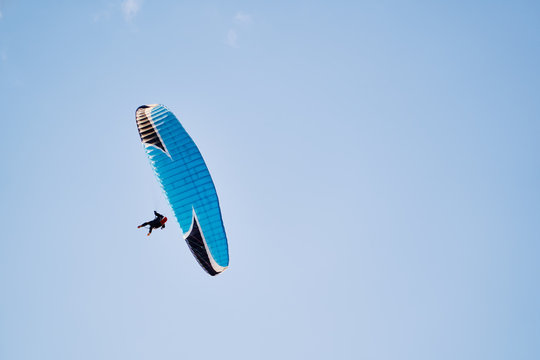 Paraplane on the blue sky background, leisure activity.