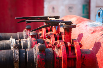 Handle controlling gate valve of water pumping unit which is used in oil field operation. Heavy...