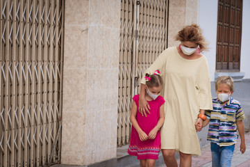 Obraz na płótnie Canvas Family wearing facial disposable mask. Coronavirus protection