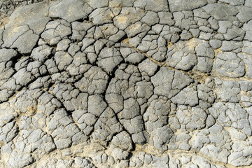 Cracked soil in Berca Muddy Volcanoes area in Buzau, Romania; active muddy volcanoes