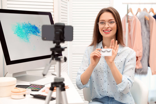 Beauty blogger filming make up tutorial at home