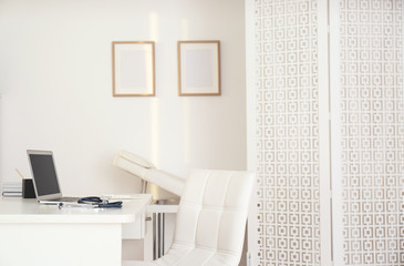 Doctor's workplace with modern laptop in medical office