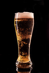 Glass beer on wood background with copy space