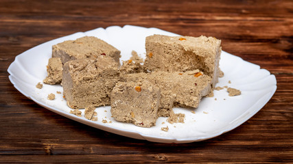 Halva in the billy tarіltsі on the dark wooden table_